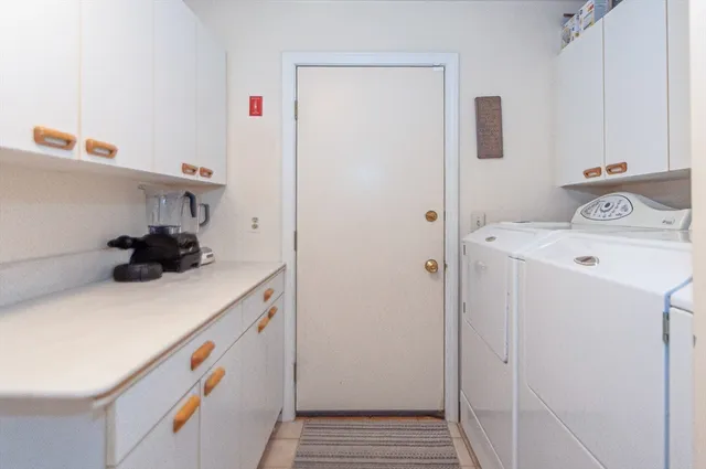 a kitchen with a refrigerator and a stove