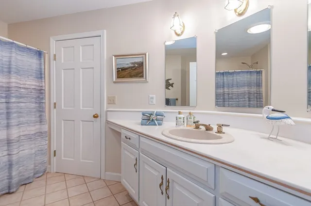 a bathroom with a sink a vanity and a mirror