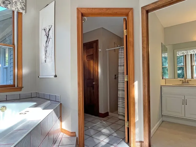 a view of a bathroom from a hallway