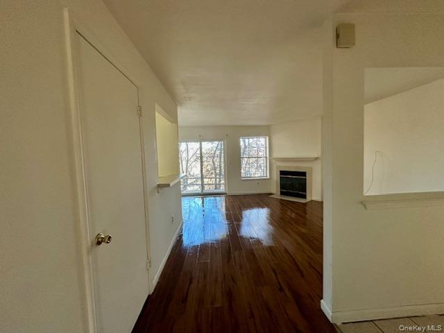 13 Lexington Hills Road, Unit 8 Harriman, NY 10926 - Photo 16 of 18 a view of empty room with wooden floor and fireplace