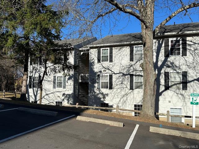 13 Lexington Hills Road, Unit 8 Harriman, NY 10926 - Photo 17 of 18 a front view of a house with a road
