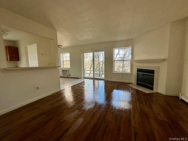 13 Lexington Hills Road, Unit 8 Harriman, NY 10926 - Photo 2 of 18 a view of an empty room with a fireplace and a window