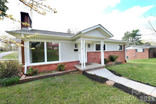 a view of front of house with a yard