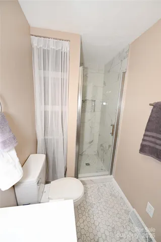 a bathroom with a tub and shower
