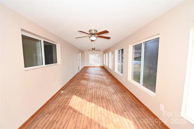a view of a living room with a ceiling fan