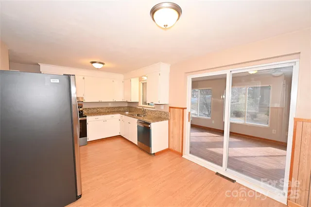 a view of a kitchen with a sink