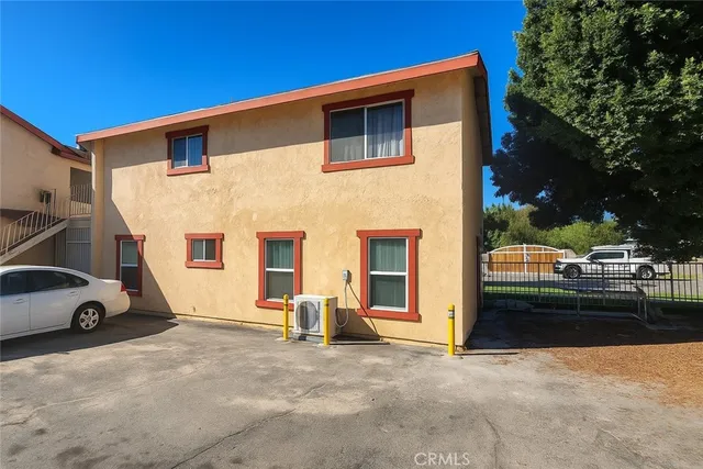 a view of a car park in front of house