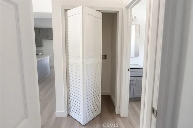 a bathroom with a shower and closet