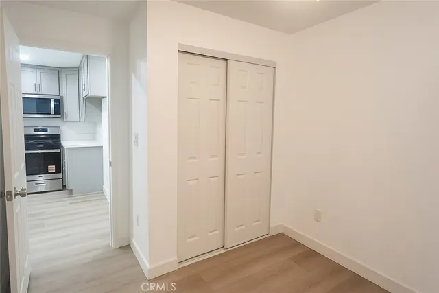 an empty room with an empty space and wooden floor