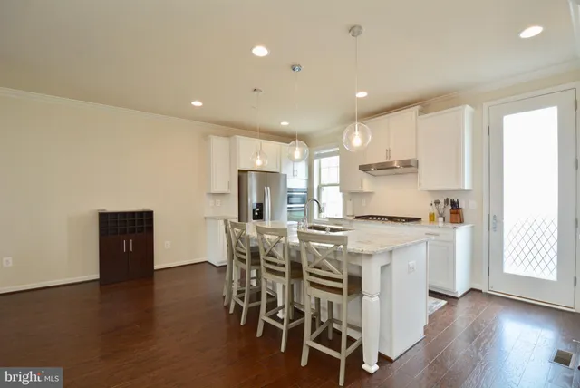 a kitchen with a table and chairs in it
