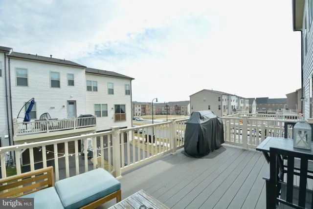 a view of a balcony with two chairs and a table