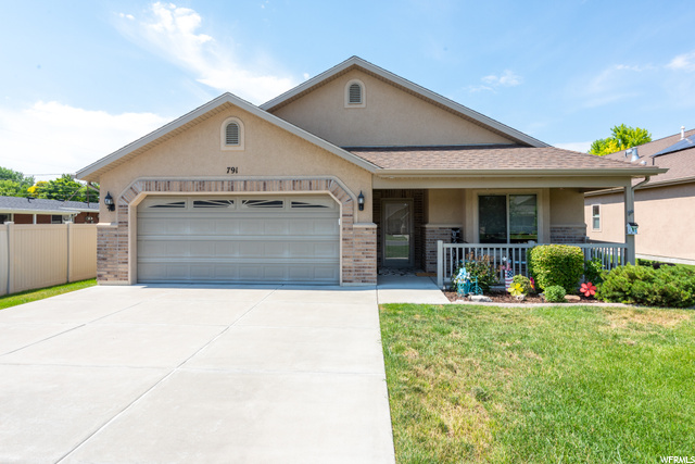 791 East 200 South Layton, UT 84041 - Photo 1 of 1 View of front of home with a front yard