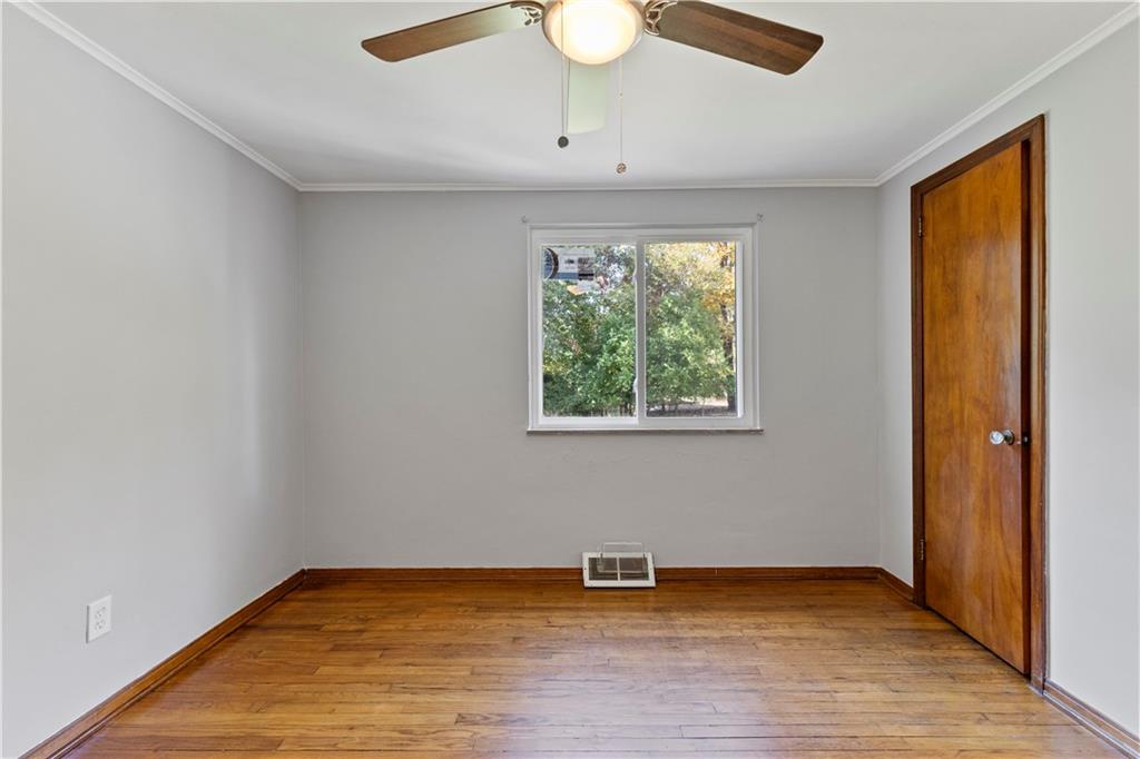124 Saunders Station Road Trafford, PA 15085 - Photo 11 of 27 an empty room with wooden floor and windows