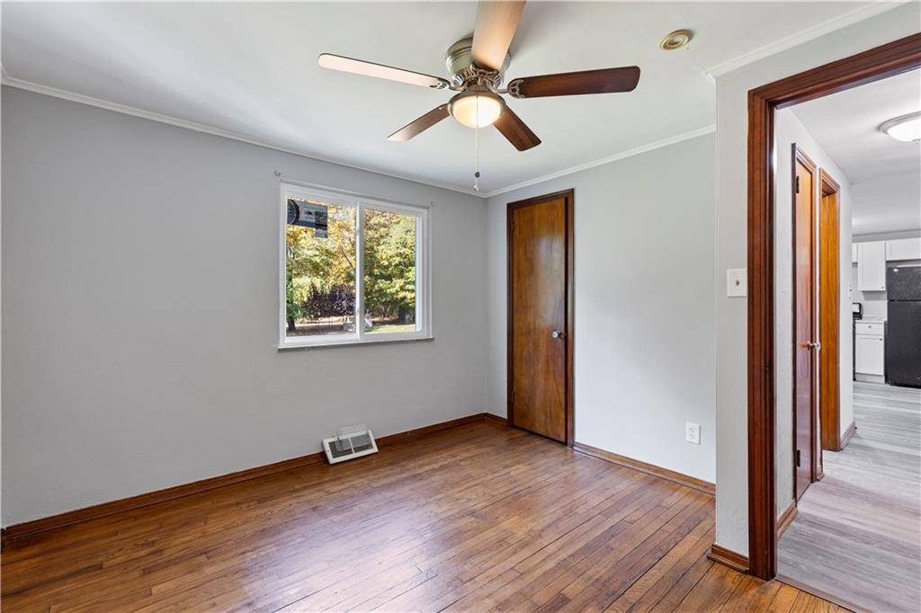 124 Saunders Station Road Trafford, PA 15085 - Photo 12 of 27 wooden floor in an empty room with a window