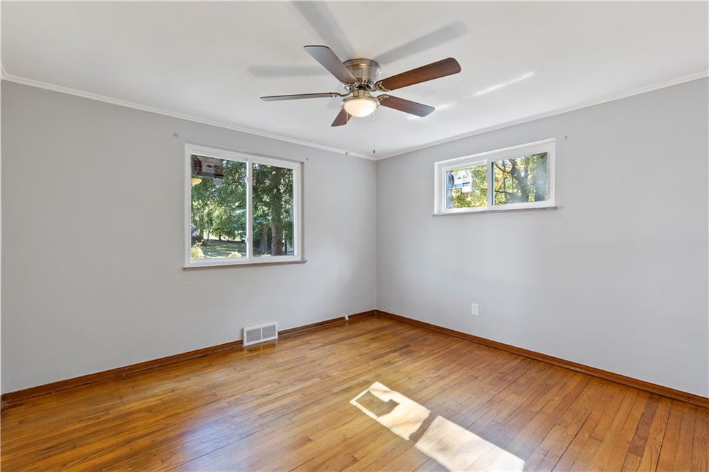 124 Saunders Station Road Trafford, PA 15085 - Photo 13 of 27 wooden floor in an empty room with a window