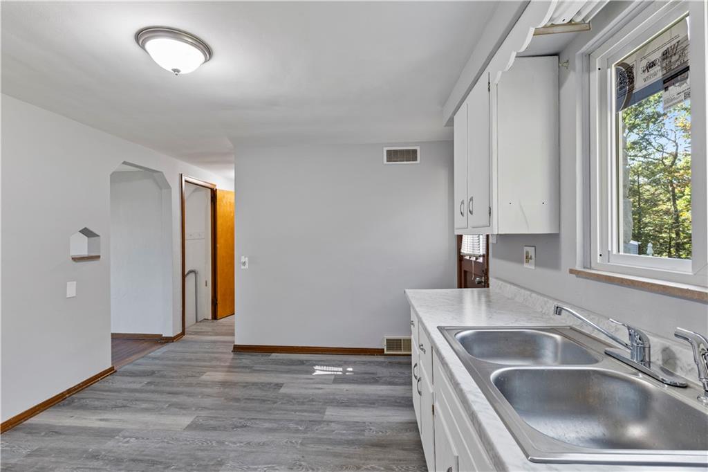 124 Saunders Station Road Trafford, PA 15085 - Photo 6 of 27 a kitchen that has a sink and a stove top oven
