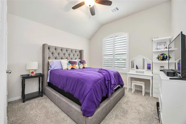 a bed room with a bed and a chandelier