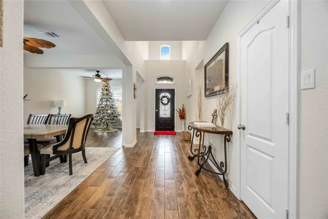 a view of a livingroom with furniture and wooden floor