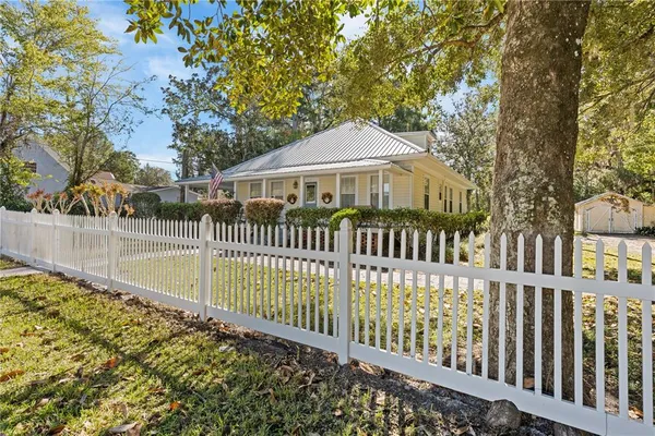 a view of a house with a small yard