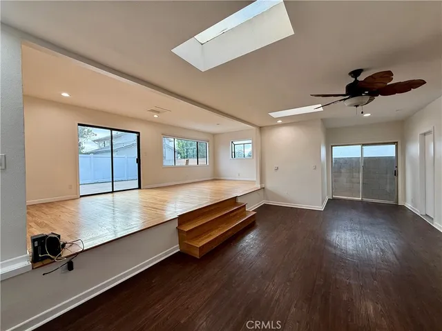 a view of room with window and hardwood floor