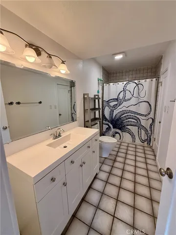 a bathroom with a double vanity sink mirror and