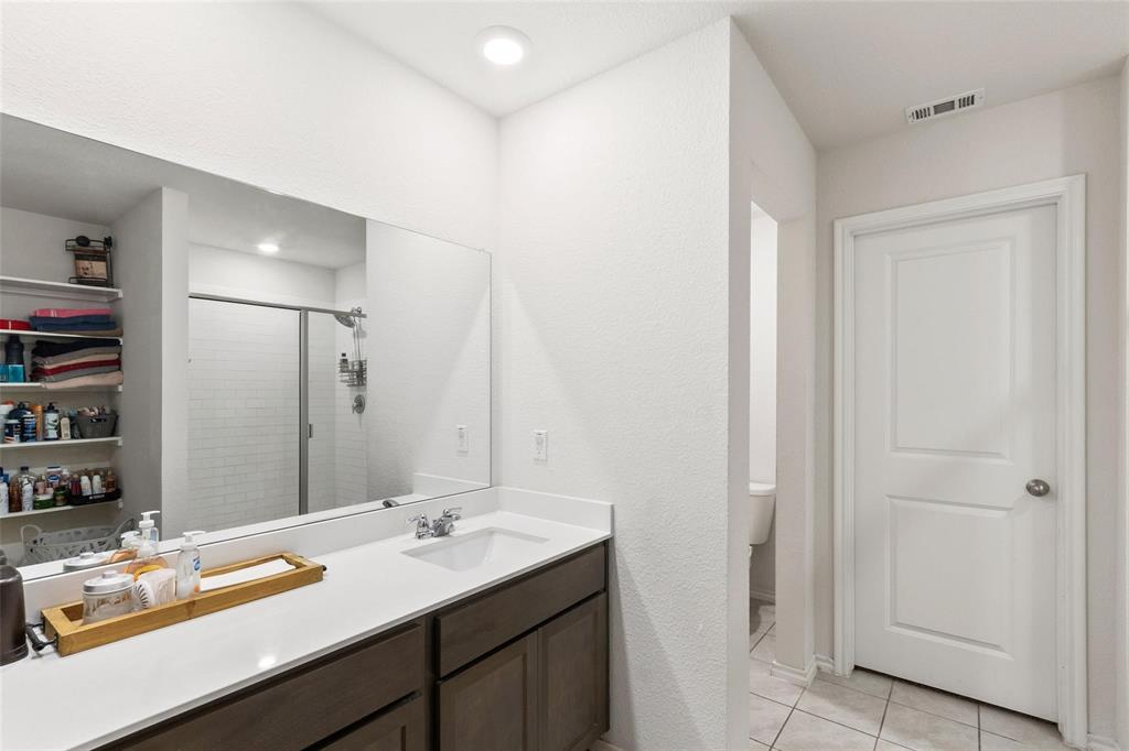 151 Seabiscuit Road Caddo Mills, TX 75135 - Photo 18 of 40 a bathroom with a sink and a mirror