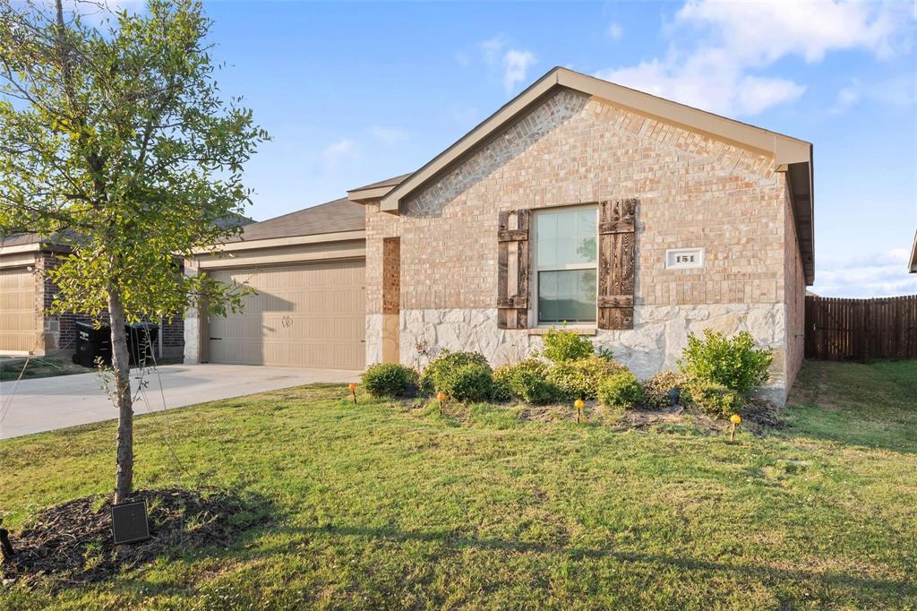 151 Seabiscuit Road Caddo Mills, TX 75135 - Photo 2 of 40 a front view of a house with garden