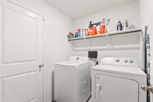 a room that has a dresser and a chair in it