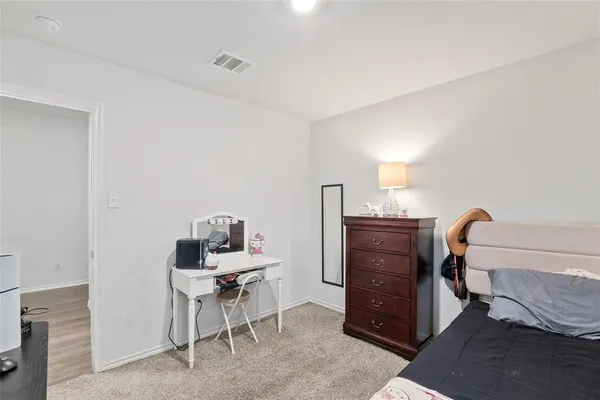 a bathroom with a toilet and a shower curtain