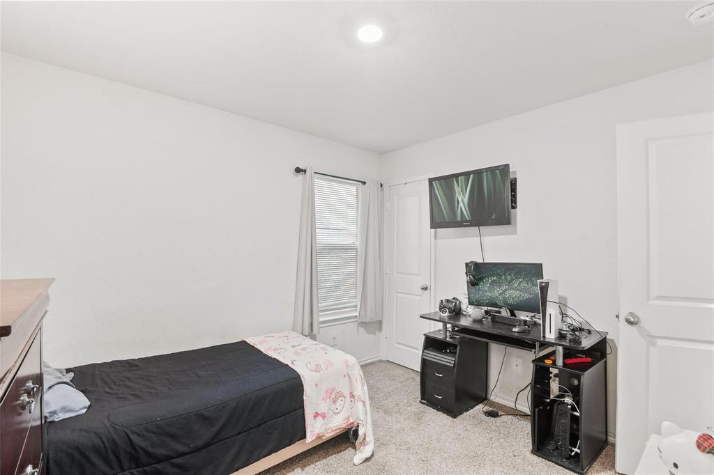 151 Seabiscuit Road Caddo Mills, TX 75135 - Photo 25 of 40 a bedroom with a bed a flat screen tv and dresser