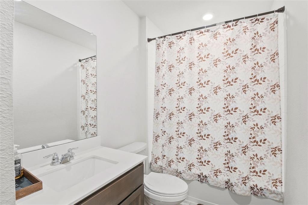 151 Seabiscuit Road Caddo Mills, TX 75135 - Photo 27 of 40 a bathroom with a sink toilet and shower