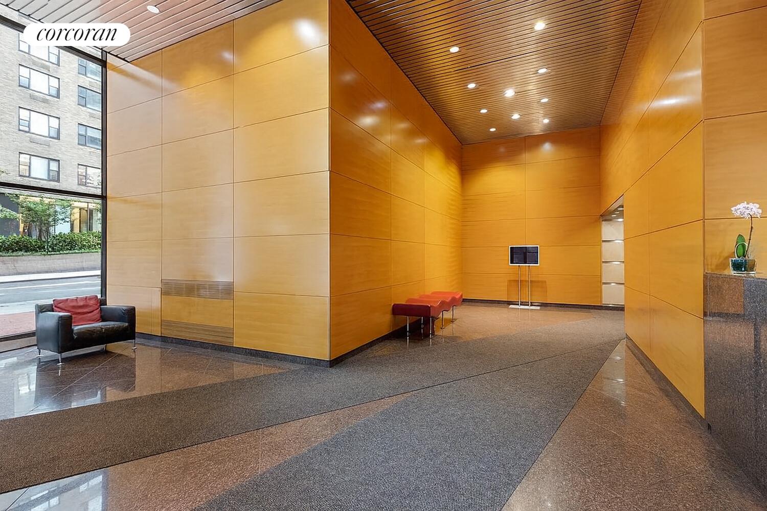 250 East 40th Street, Unit 17F Manhattan, NY 10016 - Photo 10 of 16 a view of an empty room with a couch