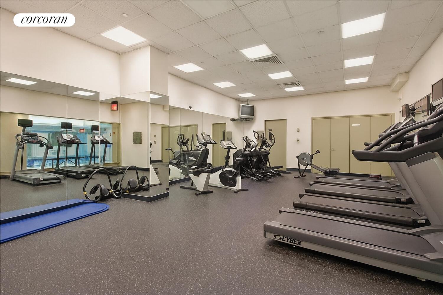 250 East 40th Street, Unit 17F Manhattan, NY 10016 - Photo 13 of 16 a view of a room with gym equipment