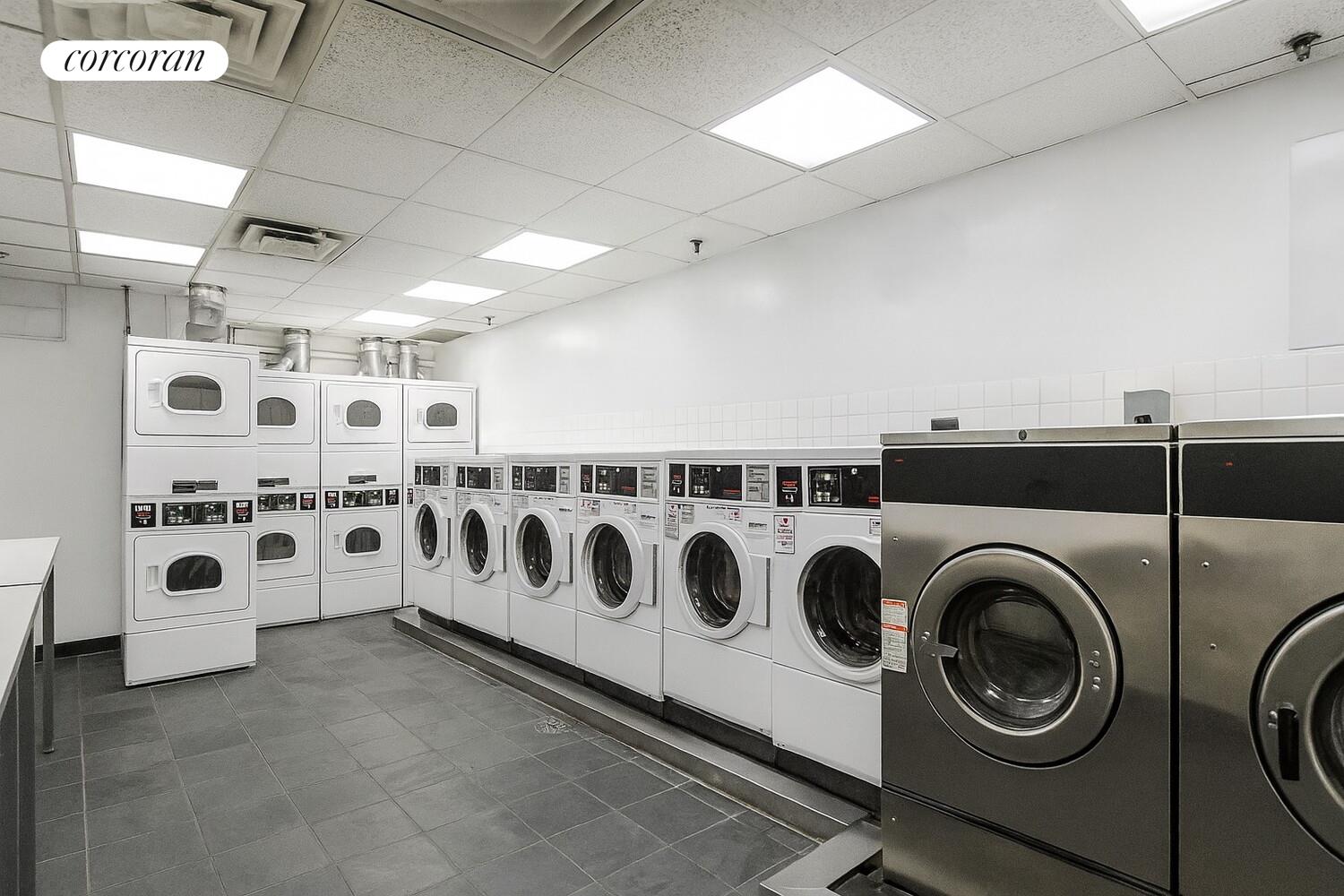 250 East 40th Street, Unit 17F Manhattan, NY 10016 - Photo 15 of 16 a utility room with multiple dryer and washer