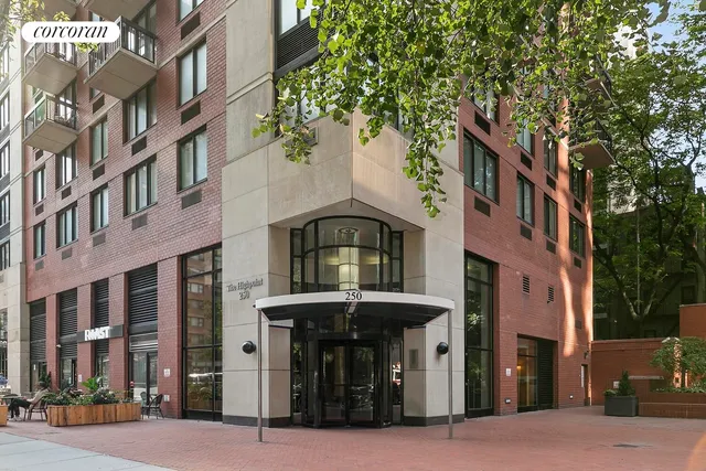 a bathroom with a granite countertop sink mirror vanity and toilet