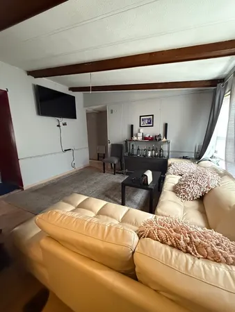 a bedroom with a bed and chair