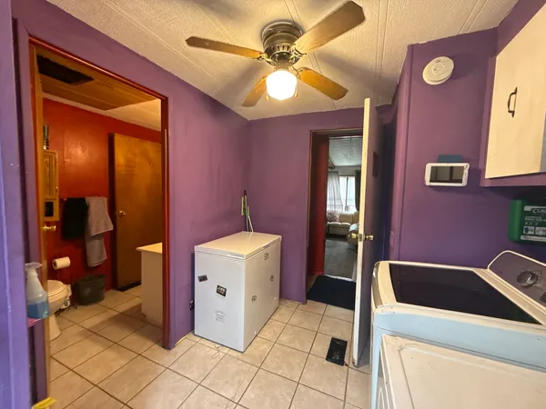 a kitchen that has a sink and a stove top oven