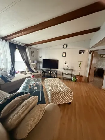 a bedroom with furniture and a window