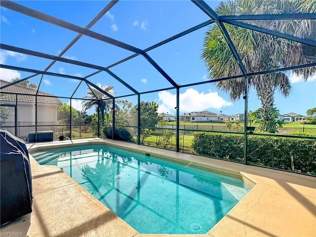 a view of a swimming pool with a patio