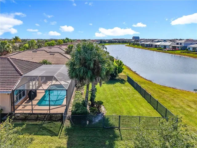 a view of a swimming pool with a table and chairs