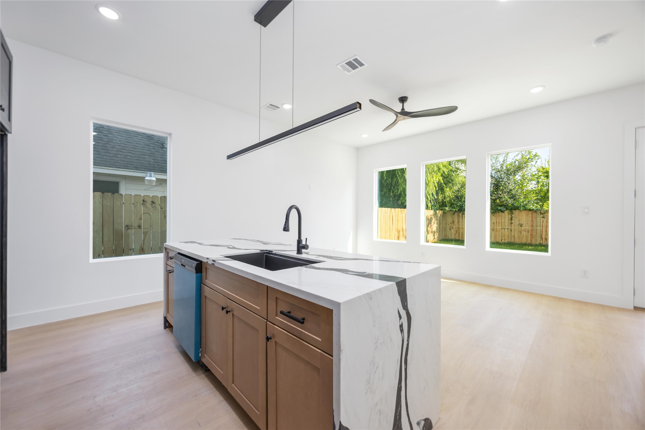 3920 Aledo Street, Unit AB Houston, TX 77051 - Photo 11 of 27 a kitchen with stainless steel appliances granite countertop a sink a stove and a refrigerator