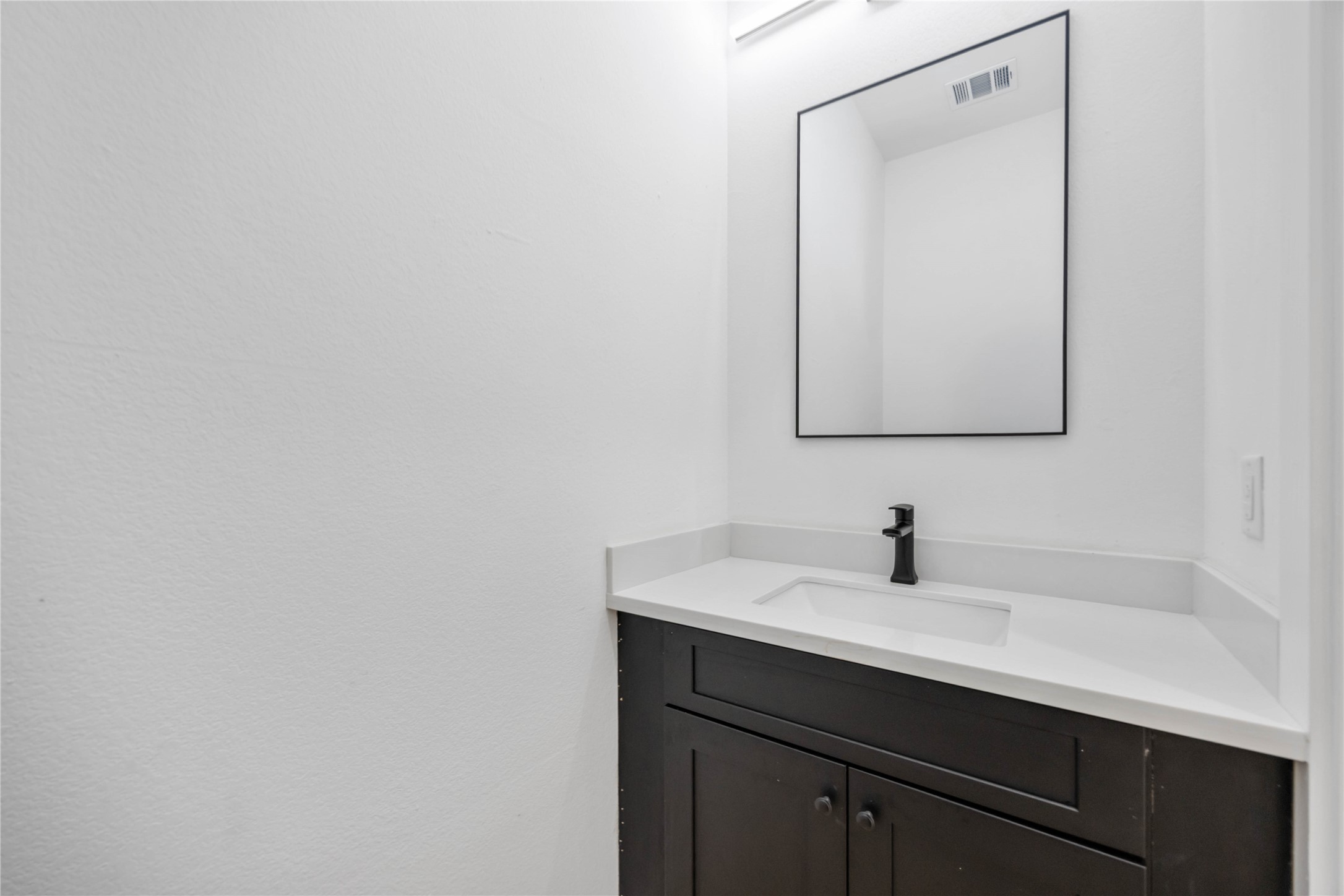 3920 Aledo Street, Unit AB Houston, TX 77051 - Photo 12 of 27 a bathroom with a sink and a mirror