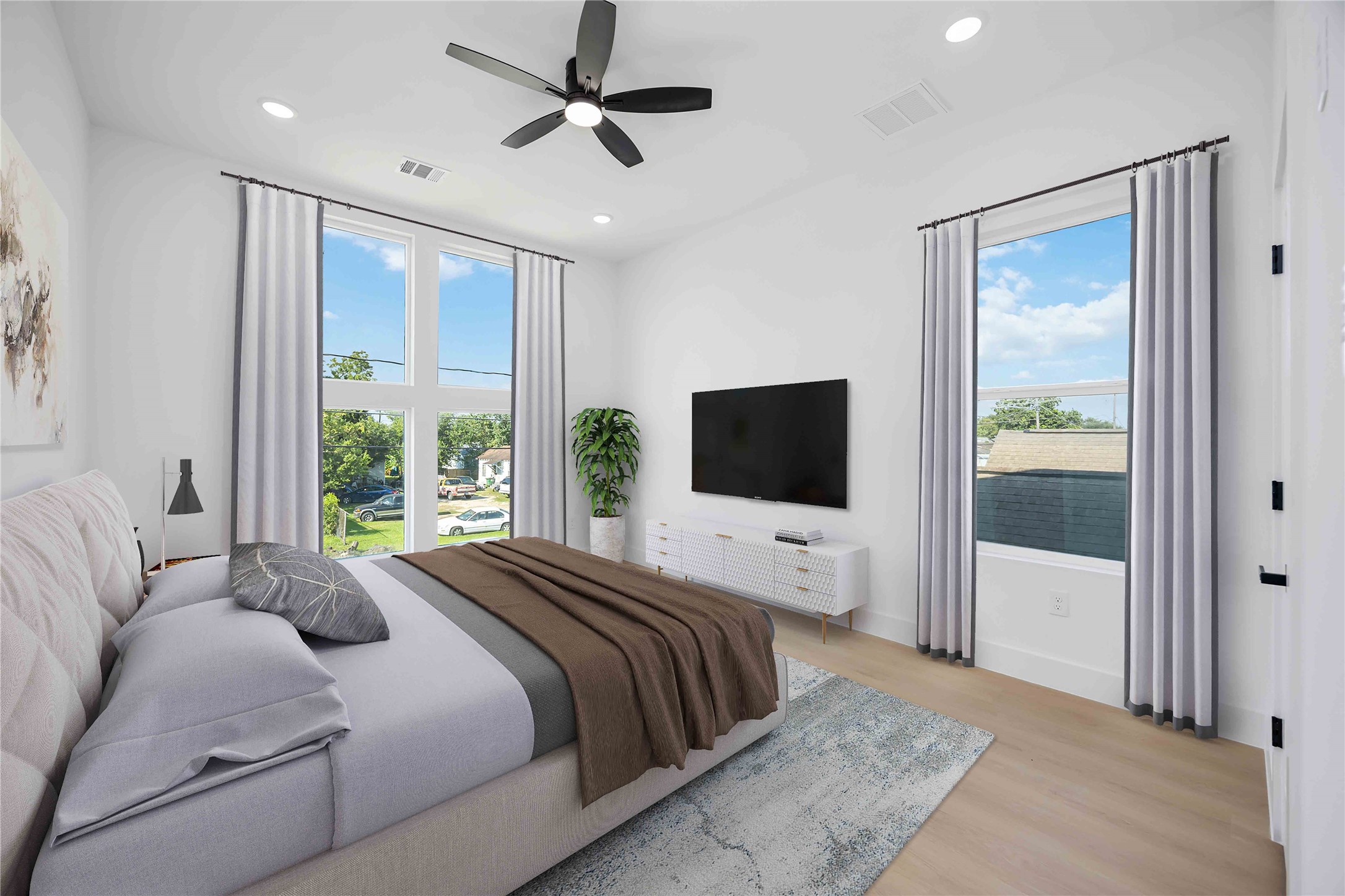 3920 Aledo Street, Unit AB Houston, TX 77051 - Photo 15 of 27 a bedroom with a large bed and a flat screen tv