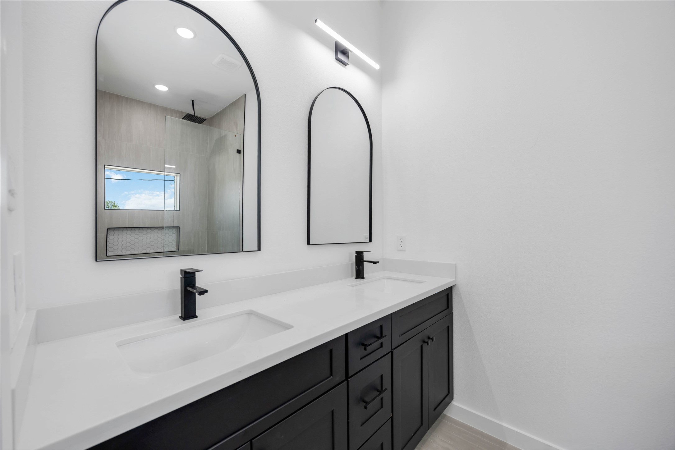 3920 Aledo Street, Unit AB Houston, TX 77051 - Photo 19 of 27 a bathroom with a double vanity sink and a mirror