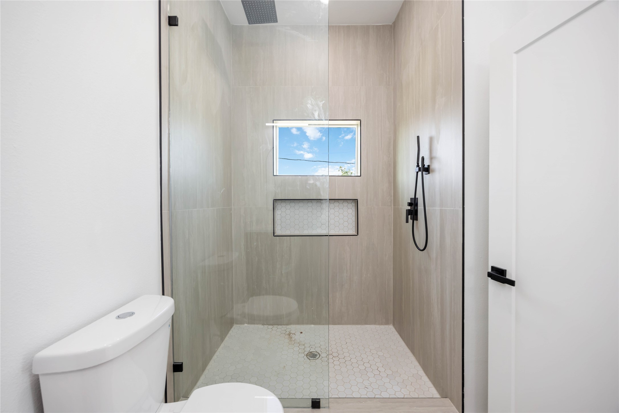 3920 Aledo Street, Unit AB Houston, TX 77051 - Photo 20 of 27 a bathroom with a shower and toilet