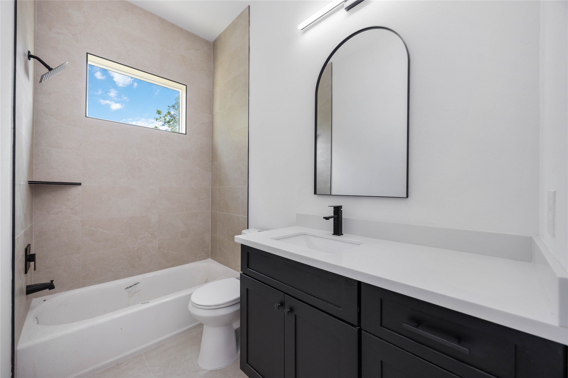 3920 Aledo Street, Unit AB Houston, TX 77051 - Photo 25 of 27 a bathroom with a sink a toilet and a bathtub