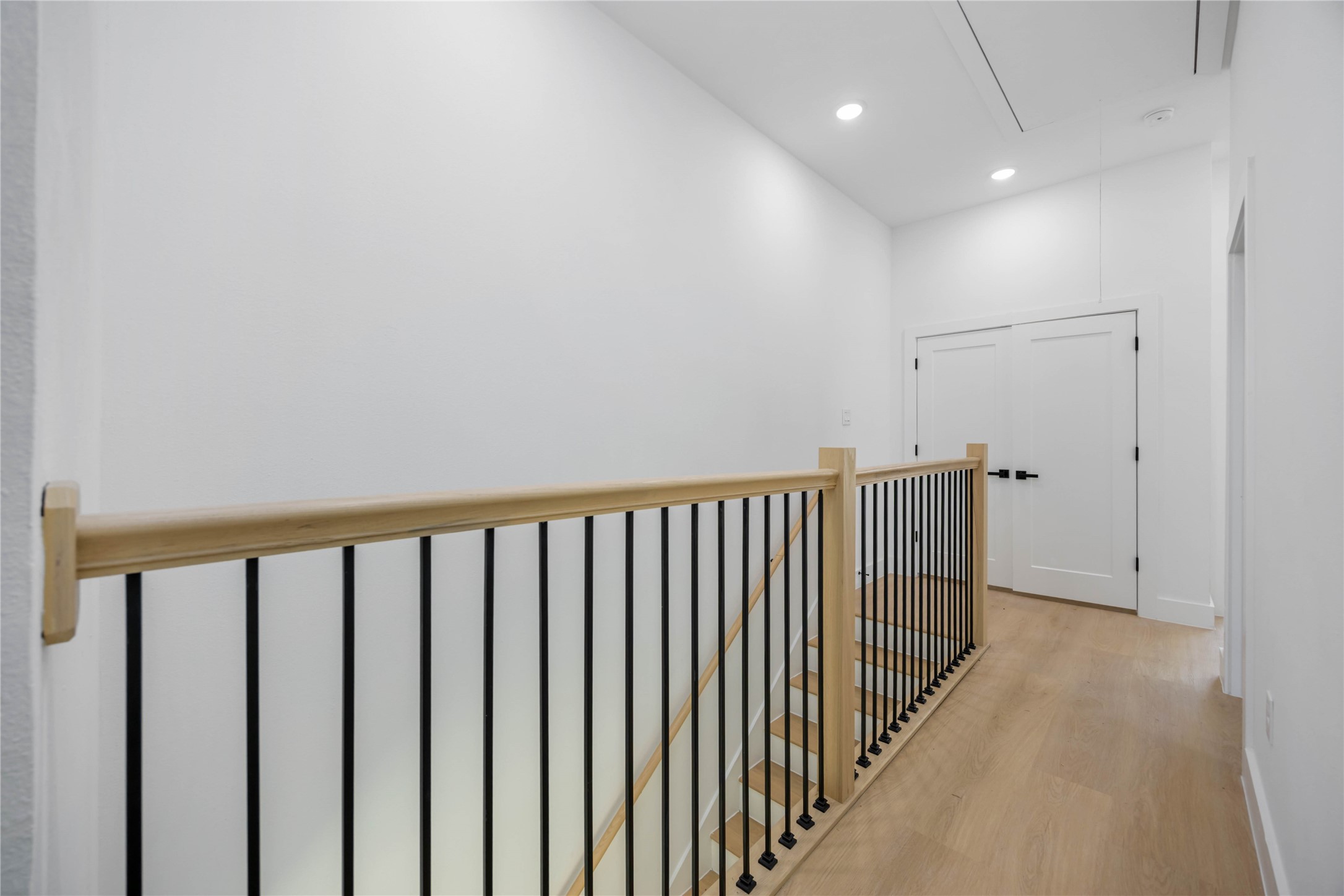 3920 Aledo Street, Unit AB Houston, TX 77051 - Photo 26 of 27 a view of a hallway with wooden floor