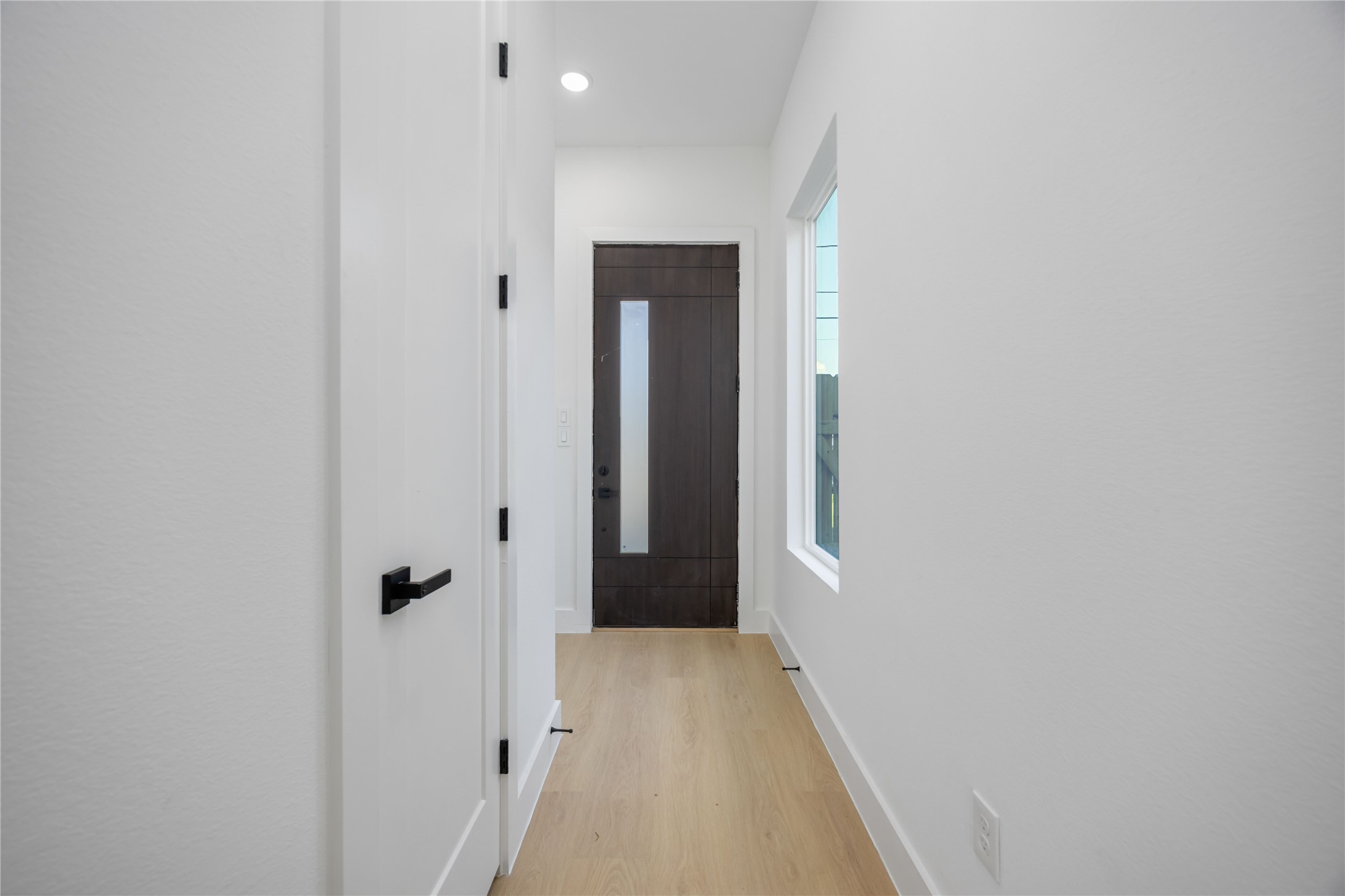 3920 Aledo Street, Unit AB Houston, TX 77051 - Photo 3 of 27 a view of a hallway with wooden floor