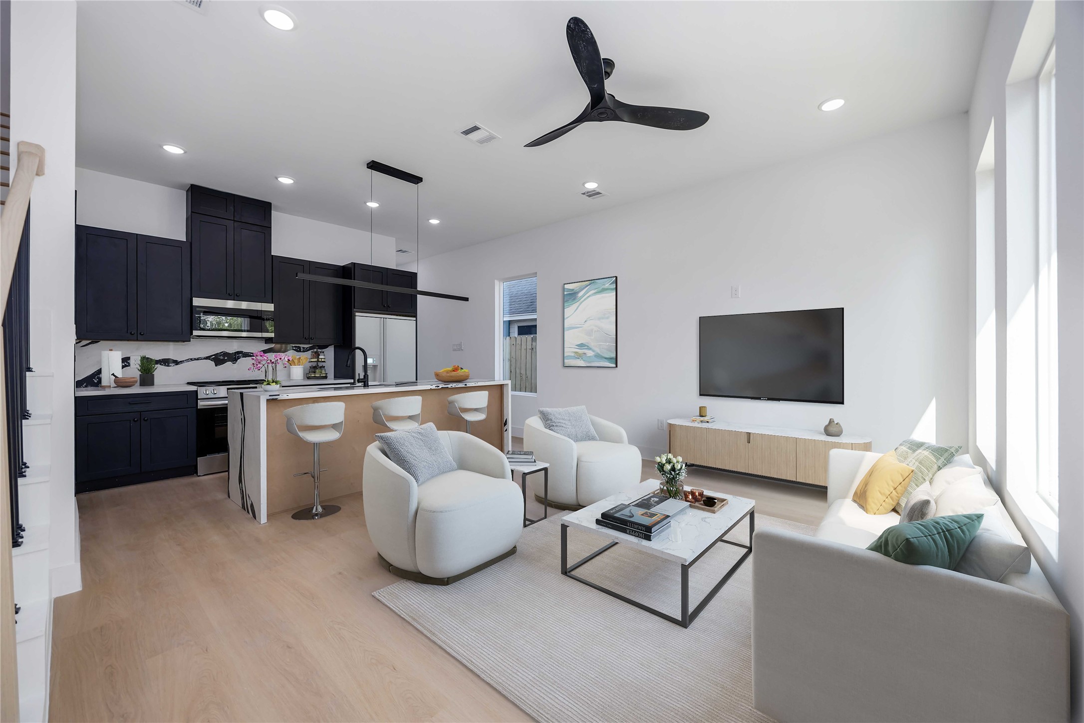 3920 Aledo Street, Unit AB Houston, TX 77051 - Photo 5 of 27 a living room with furniture kitchen and a flat screen tv
