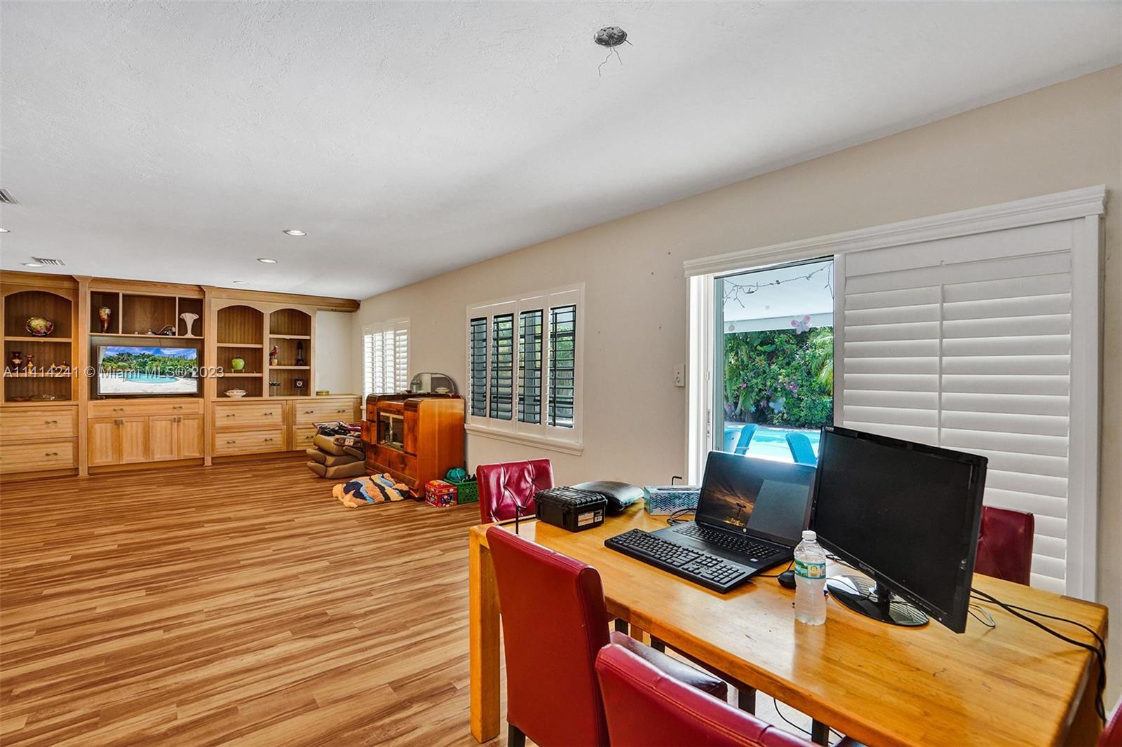 9020 Southwest 187th Terrace Cutler Bay, FL 33157 - Photo 12 of 55 a view of a workspace with furniture and a window